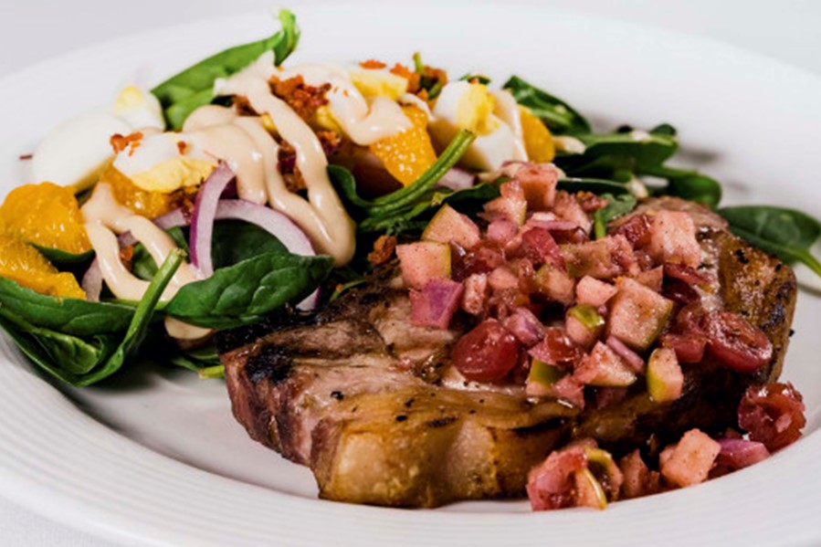 Grilled chop with spinach salad